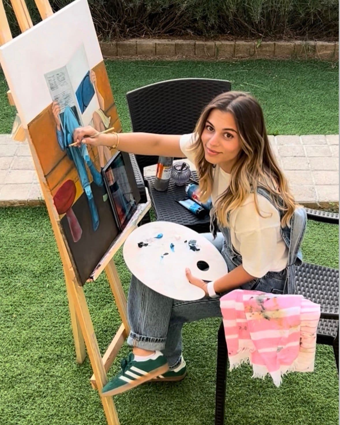 Artist painting in studio