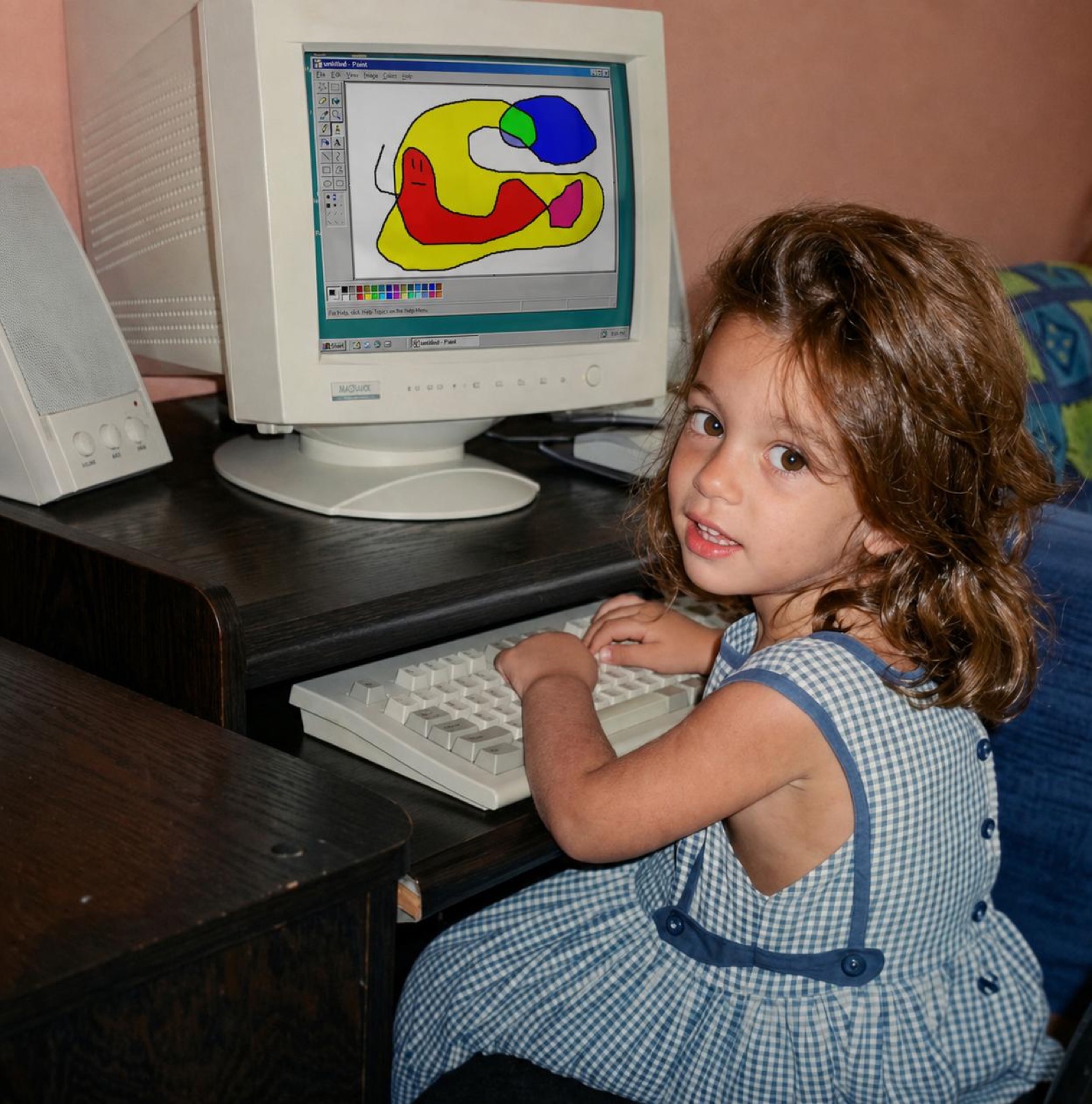 Myriam as a little girl drawing in Microsoft Paint on an old computer
