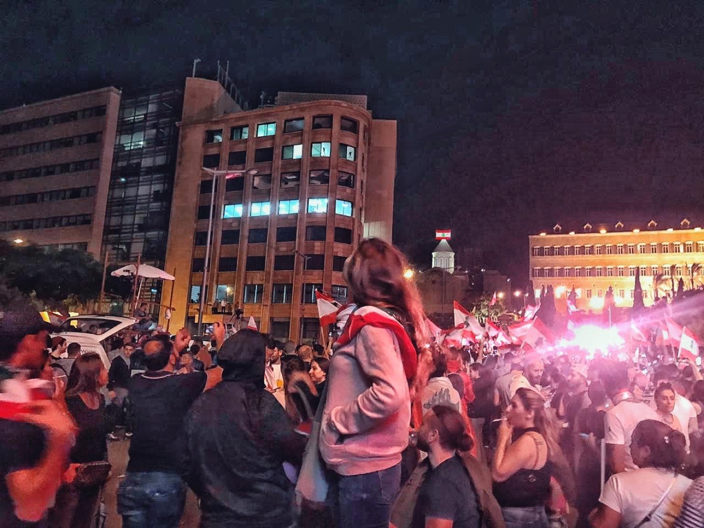 Night crowd with Lebanese flags in downtown Beirut